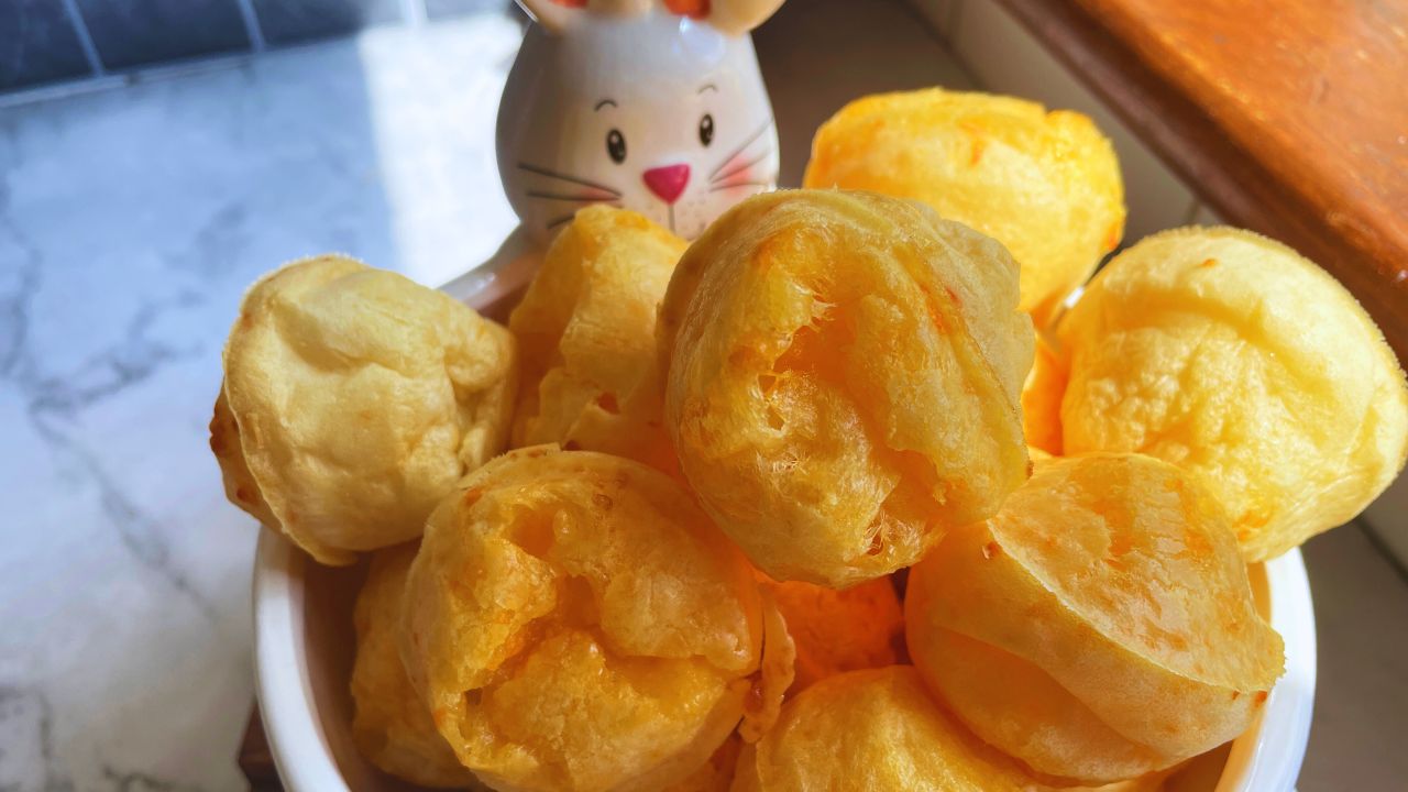 Freshly baked golden Brazilian Cheese Bread served in a bunny dish