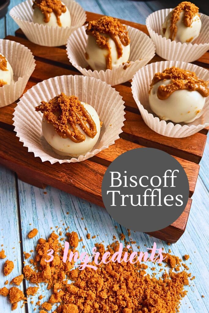 Biscoff Truffles served in mini white cases on a wooden board