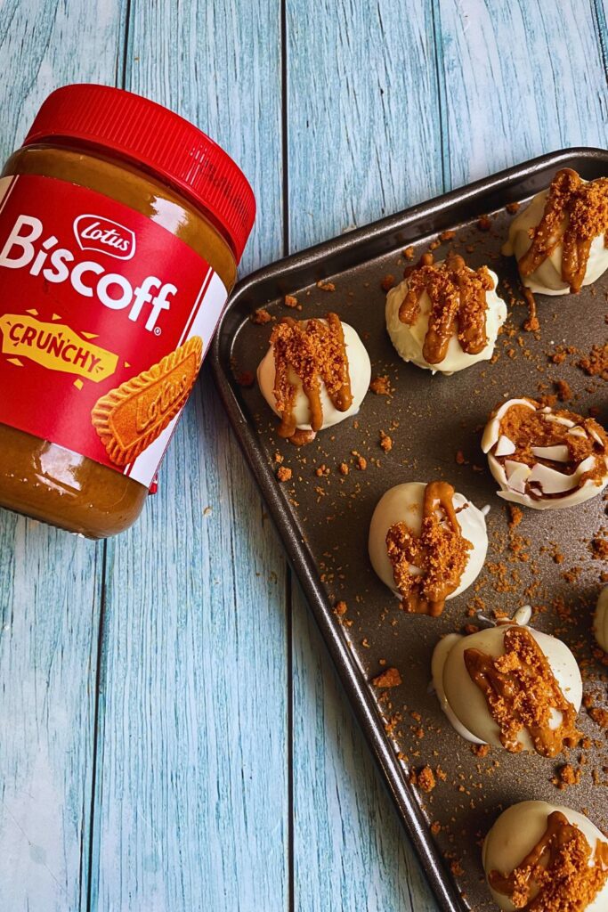 Biscoff Truffles served in a tray with Biscoff spread jar by the side