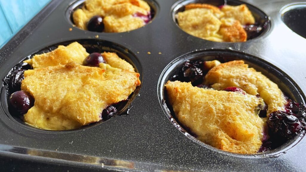 Freshly made Blueberry French Toast Cups in a muffin pan