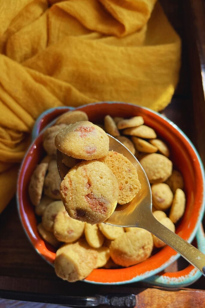 Close up shot of spoonful of breakfast Cookie Crisp Cereal and also on a bowl