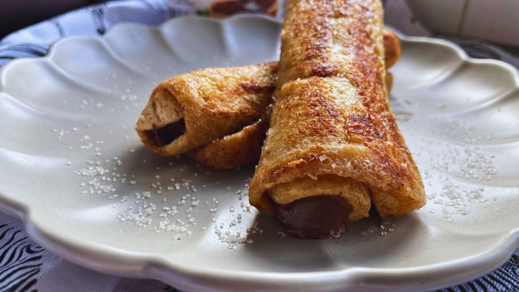 2 Nutella French Toast Rolls served in a grey plate