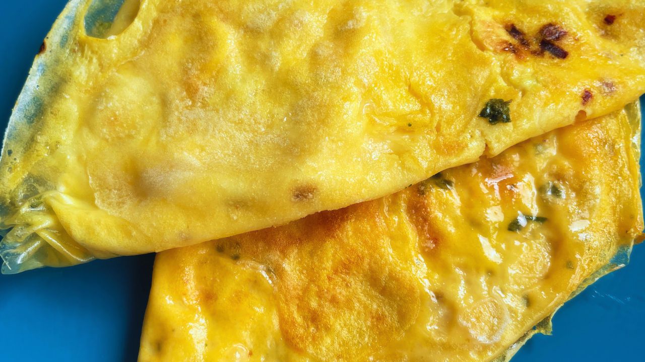 2 crispy Rice paper omlettes served in a blue plate