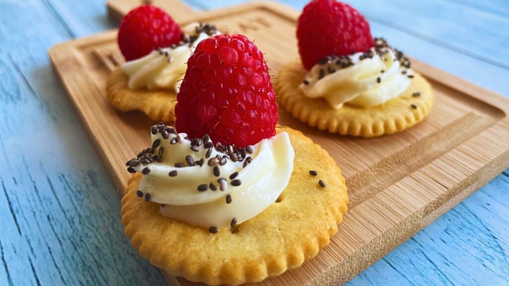 3 Party Appetisers Raspberry & Cream Cheese Crackers on a serving board