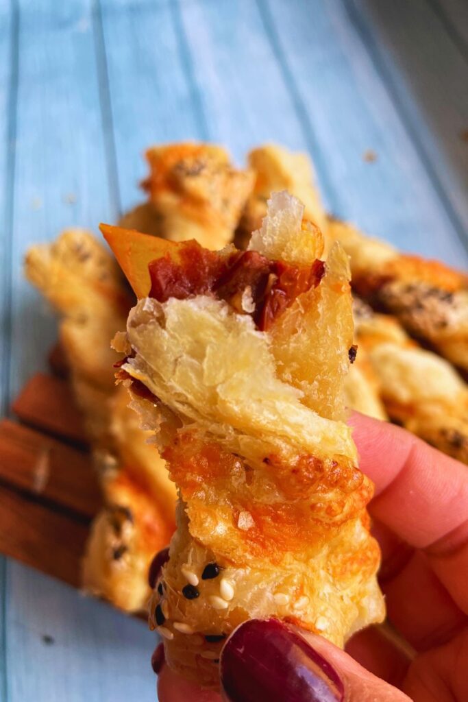 Close up shot of a half eaten Savory Puff Pastry Twist