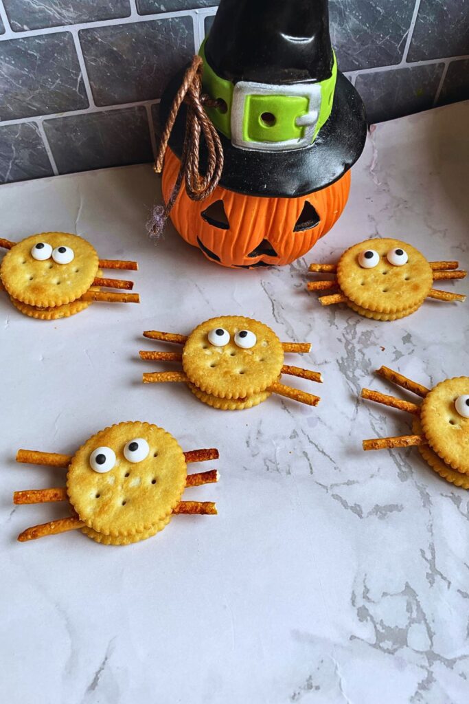 Spider Cookies laid on a marble table