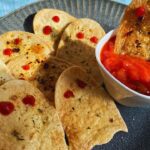 Halloween Ghost Chips With Tortilla served on a plate with some dipping sauce