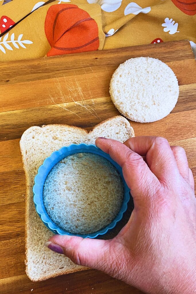 Cutting bread slices with circle cookie cutter